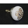 White porcelain handle with 4 round metal ornament