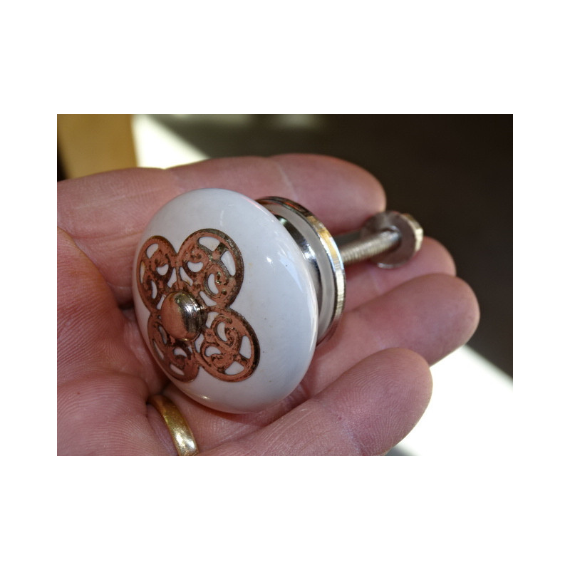 White porcelain handle with 4 round metal ornament