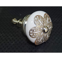 White porcelain handle with daisy metal ornament