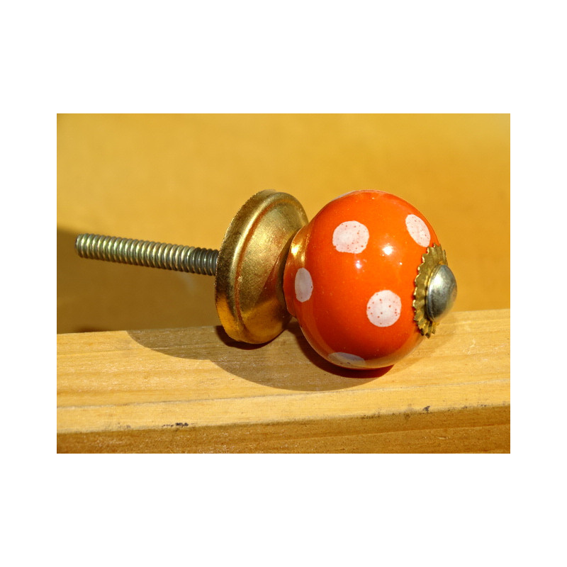 Piccolo arancio gestisce con puntini bianchi