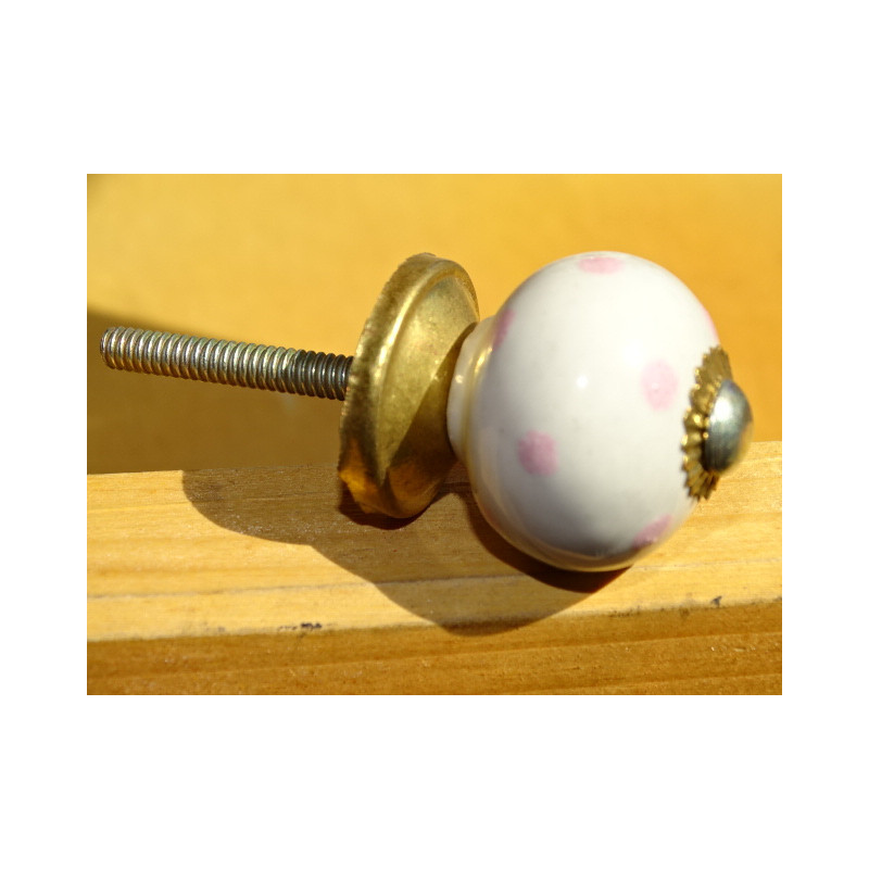 I piccoli puntini bianchi maniglie rosa