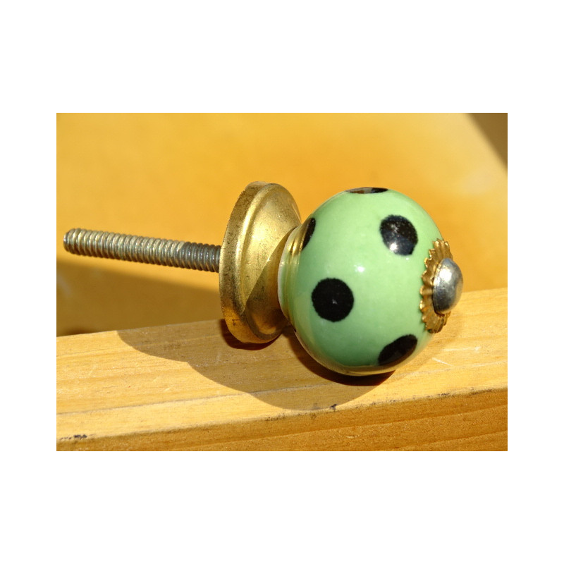 Small green handles with black dots