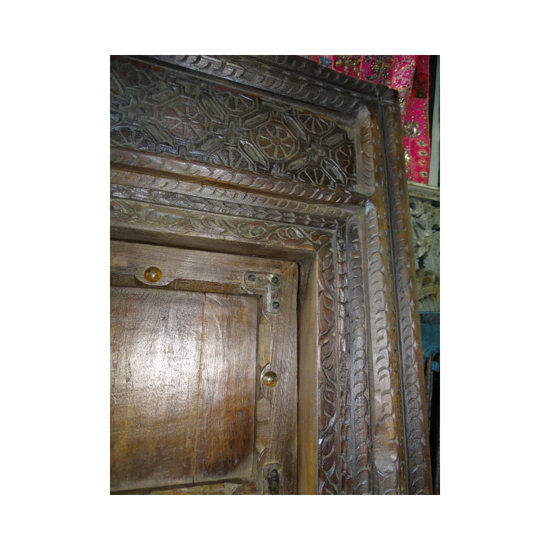 Patinated house door in dark