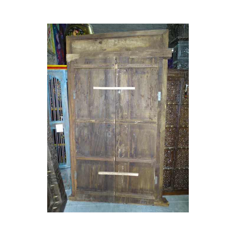 Patinated house door in dark