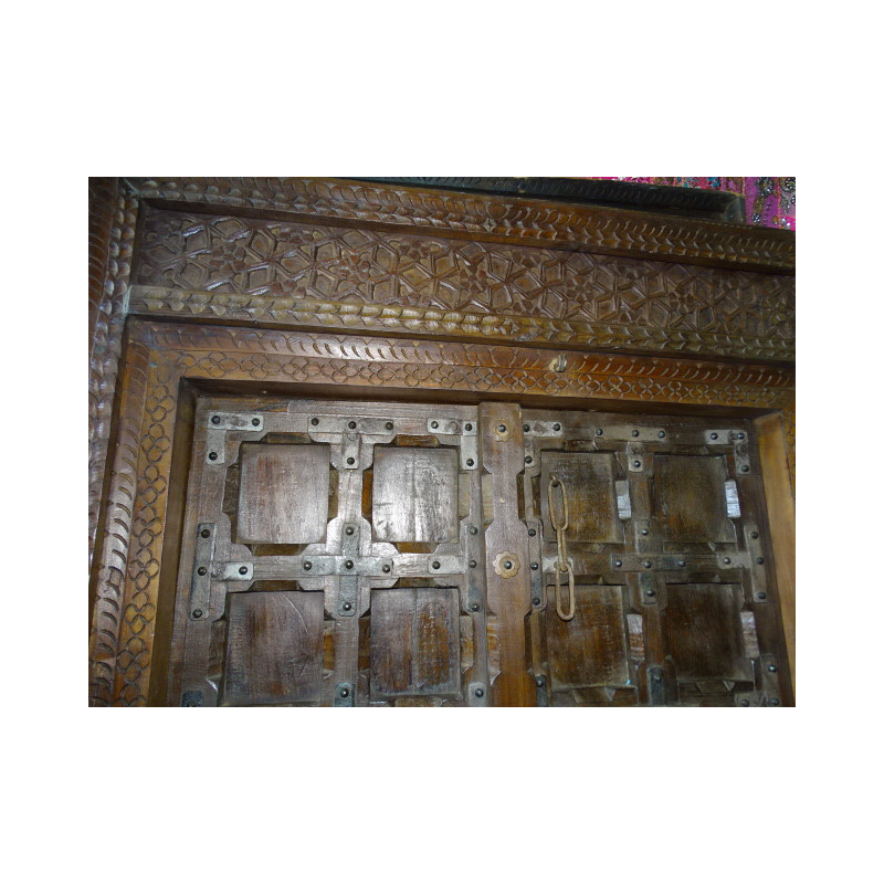 Patinated house door in dark with steel fittings