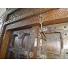 Patinated house door in dark with steel fittings