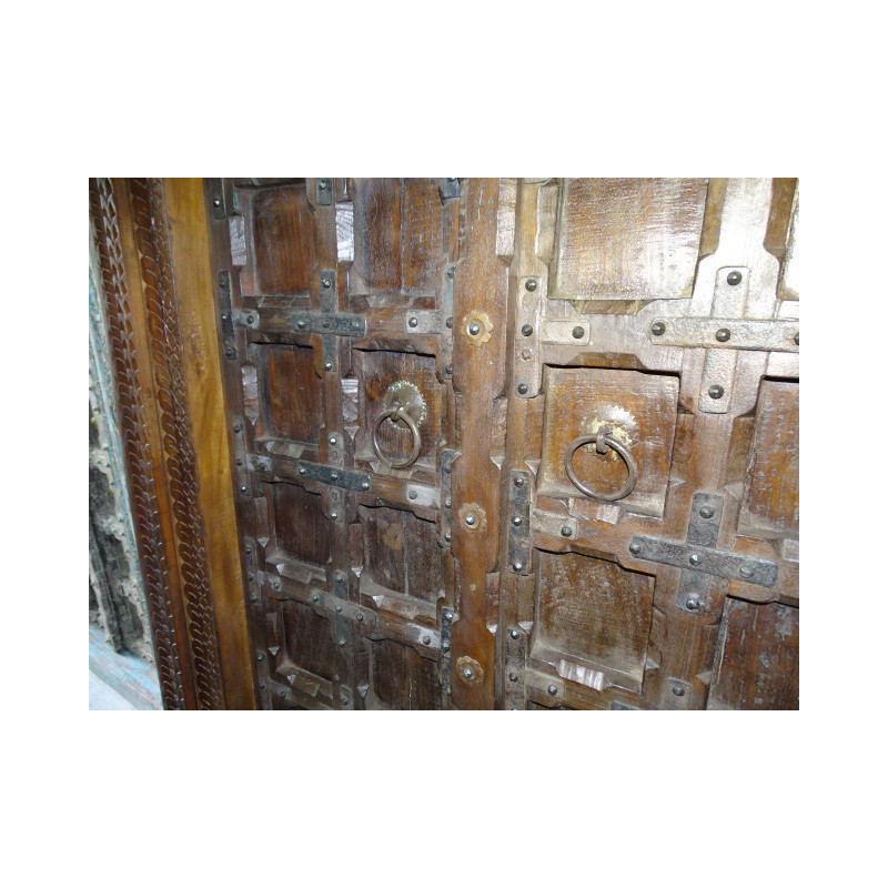 Patinated house door in dark with steel fittings