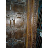 Patinated house door in dark with steel fittings