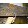 Very old low door of Indian house with coat hook