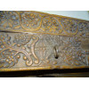 Very old low door of Indian house with coat hook