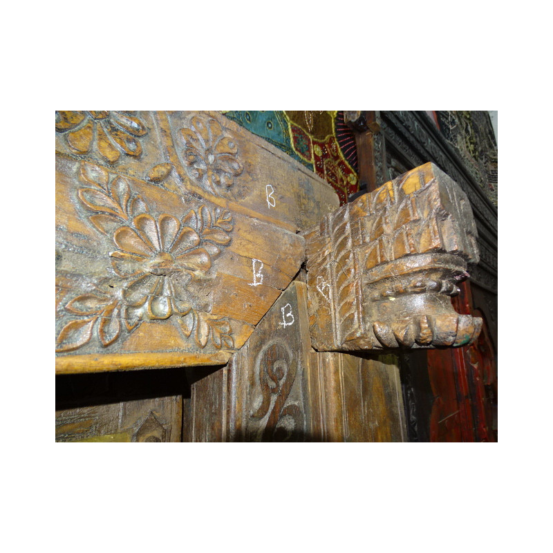 Very old low door of Indian house with coat hook