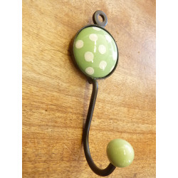 coat with one hanger a light green round  with white dots