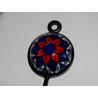 perchero de cerámica azul ultramar y flor roja